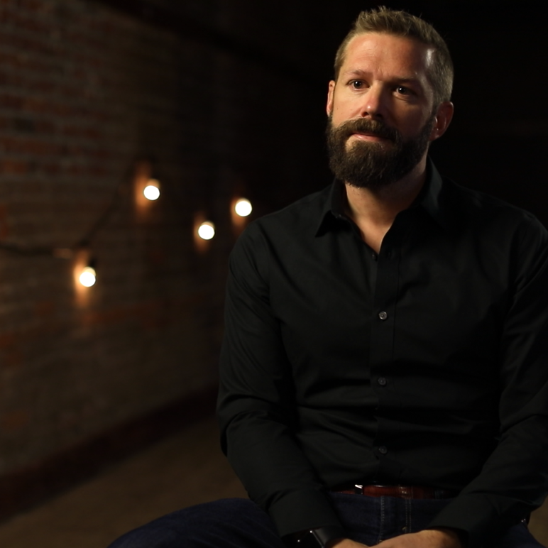 Matt Parker, CEO and CO-Founder of The Exodus Road sits in an interview setting.