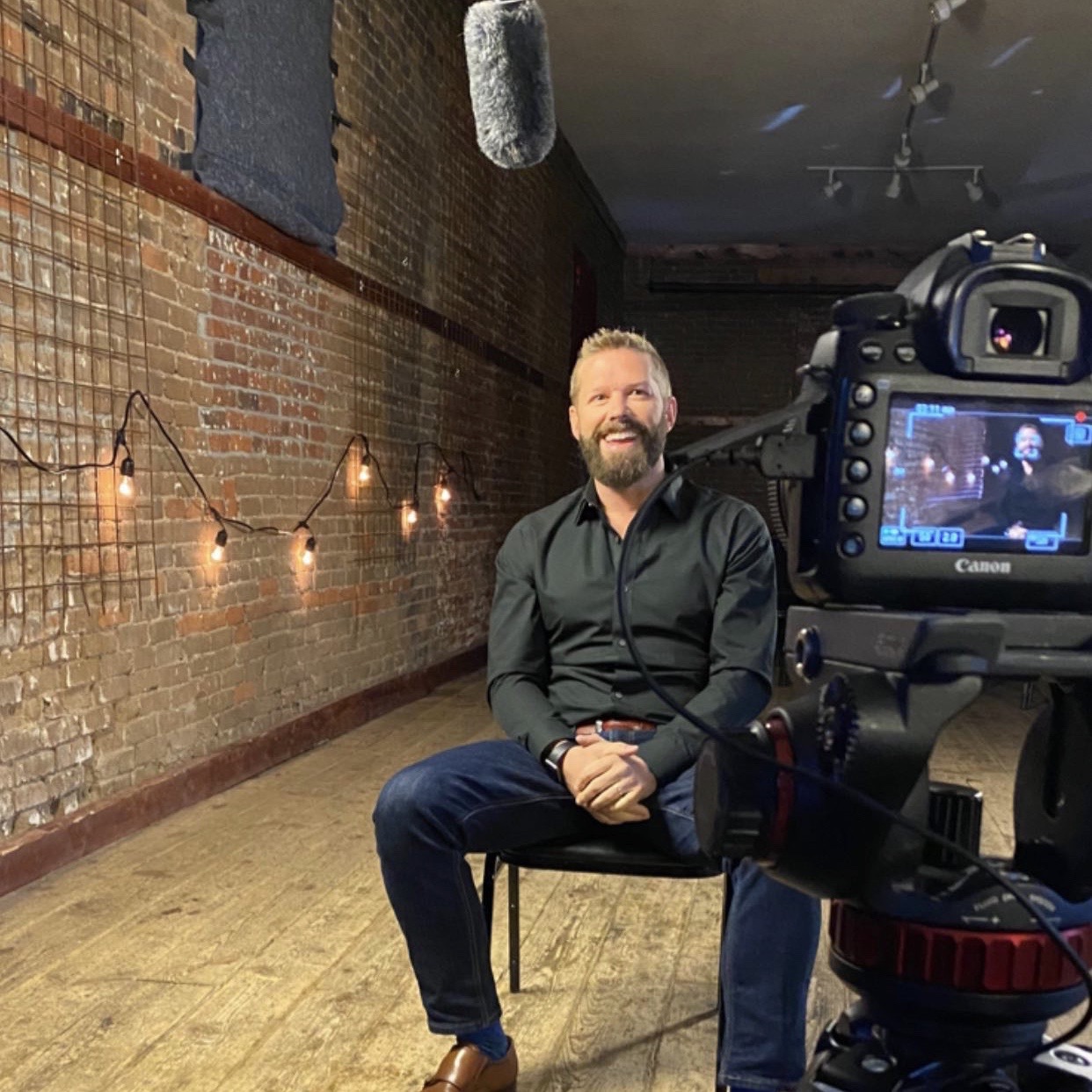 Matt Parker, CEO and CO-Founder of The Exodus Road sits in an interview setting.