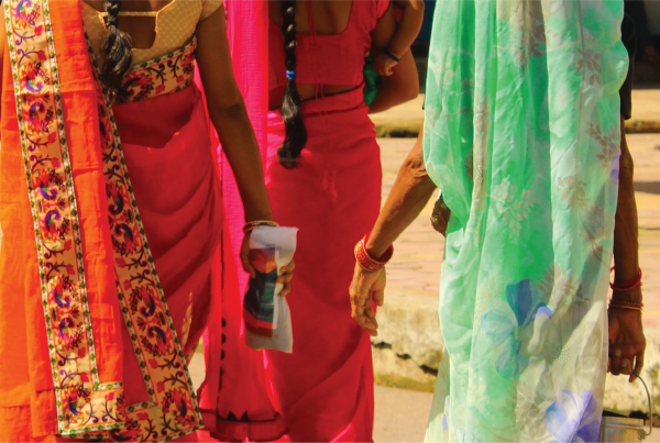 Representative image of three female Indian survivors of human trafficking, walking away from camera.